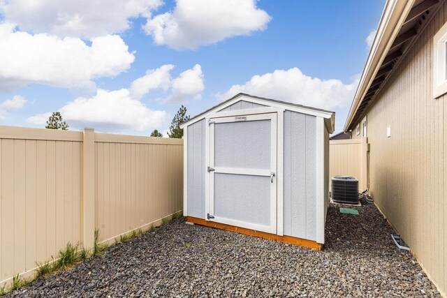 7919 W 55th Ave, Spokane, WA 99224 - view of shed with a fenced backyard and central air condition unit