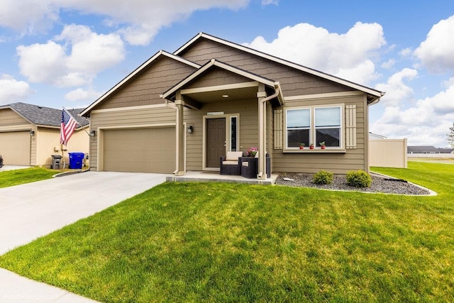 7919 W 55th Ave, Spokane, WA 99224 - view of front facade featuring driveway, a front yard, and a garage