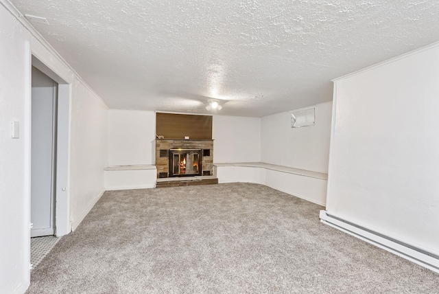 3013 E Broad Ave, Spokane, WA 99217 - unfurnished living room with a textured ceiling, carpet floors, a baseboard radiator, and a lit fireplace