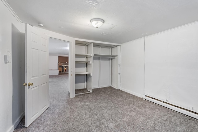 3013 E Broad Ave, Spokane, WA 99217 - unfurnished bedroom with a baseboard radiator, carpet, a closet, and a textured ceiling