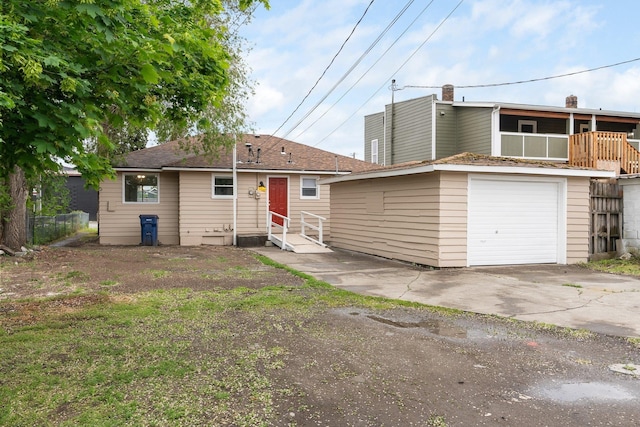 3013 E Broad Ave, Spokane, WA 99217 - back of property featuring driveway, an attached garage, a balcony, and fence