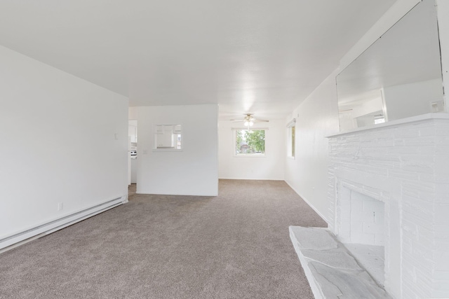 3013 E Broad Ave, Spokane, WA 99217 - unfurnished living room with carpet flooring, a baseboard heating unit, and a ceiling fan