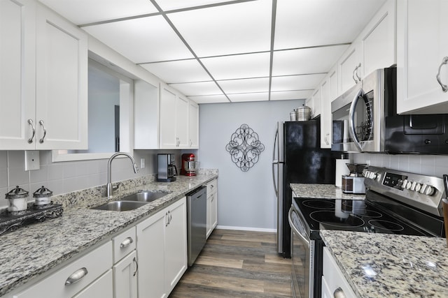 5303 N Argonne Ln Unit 13, Spokane, WA 99212 - kitchen featuring stainless steel appliances, a sink, white cabinets, tasteful backsplash, and a drop ceiling