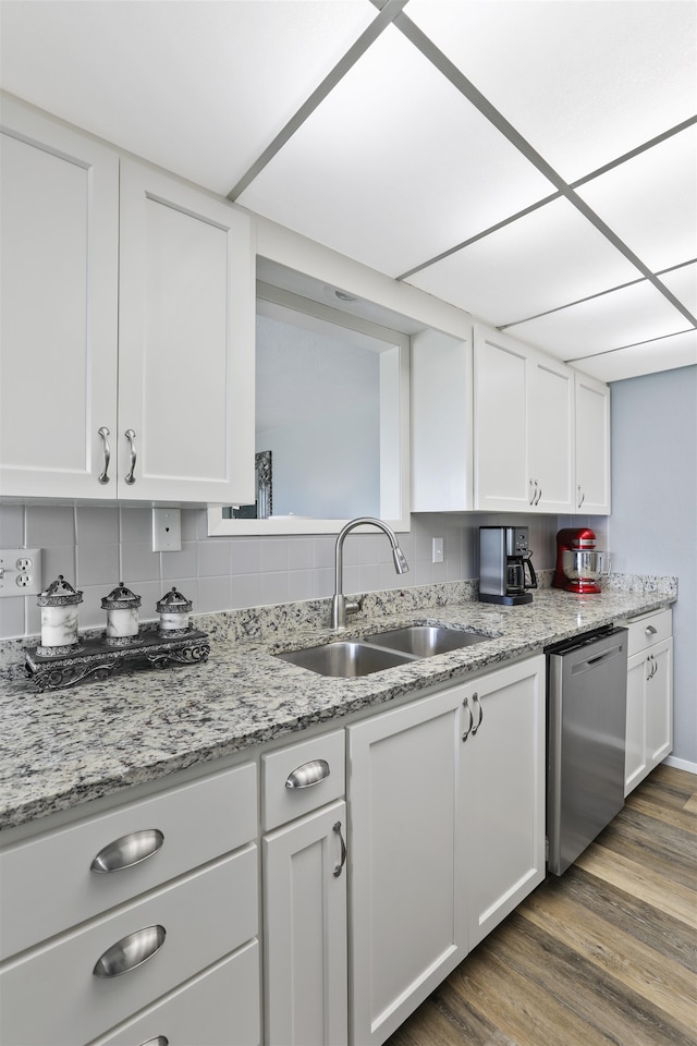 5303 N Argonne Ln Unit 13, Spokane, WA 99212 - kitchen featuring a sink, stainless steel dishwasher, white cabinetry, wood finished floors, and light stone counters
