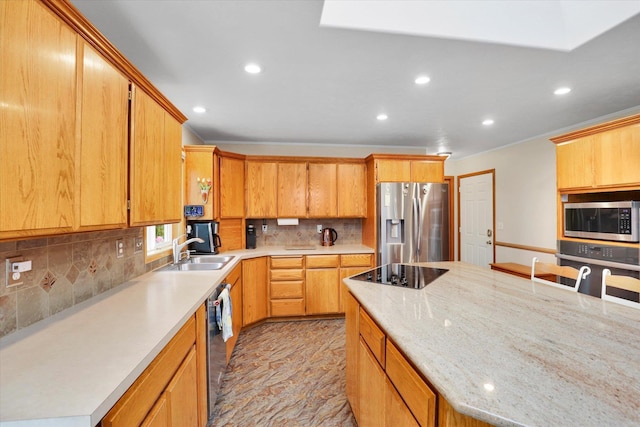 10610 N Iroquois Dr, Spokane, WA 99208 - kitchen with appliances with stainless steel finishes, a sink, recessed lighting, tasteful backsplash, and ornamental molding