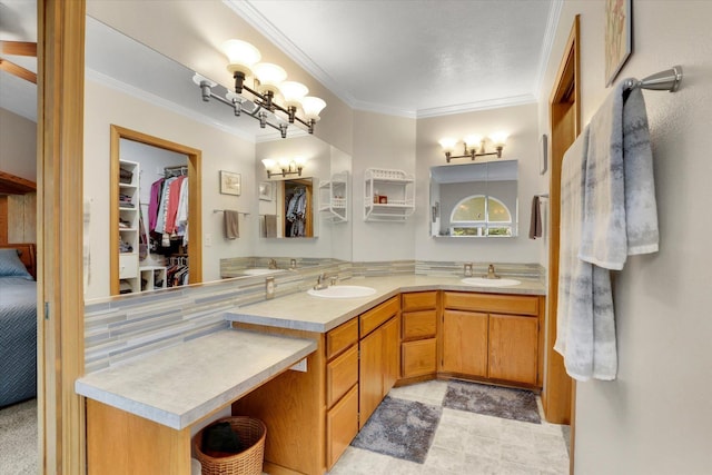 10610 N Iroquois Dr, Spokane, WA 99208 - bathroom featuring ornamental molding, double vanity, and a walk in closet