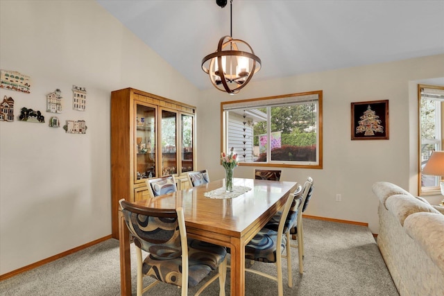 10610 N Iroquois Dr, Spokane, WA 99208 - dining room featuring light colored carpet, baseboards, a chandelier, and vaulted ceiling