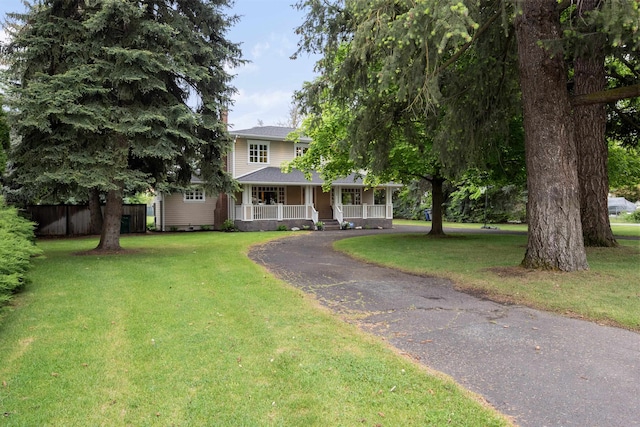 10204 N Wellen Ln, Spokane, WA 99218 - view of front facade featuring covered porch, driveway, and a front lawn