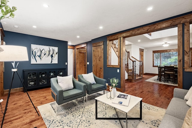 10204 N Wellen Ln, Spokane, WA 99218 - living room with stairs, baseboards, wood finished floors, and recessed lighting