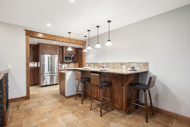10204 N Wellen Ln, Spokane, WA 99218 - kitchen with stainless steel appliances, baseboards, tasteful backsplash, a peninsula, and recessed lighting