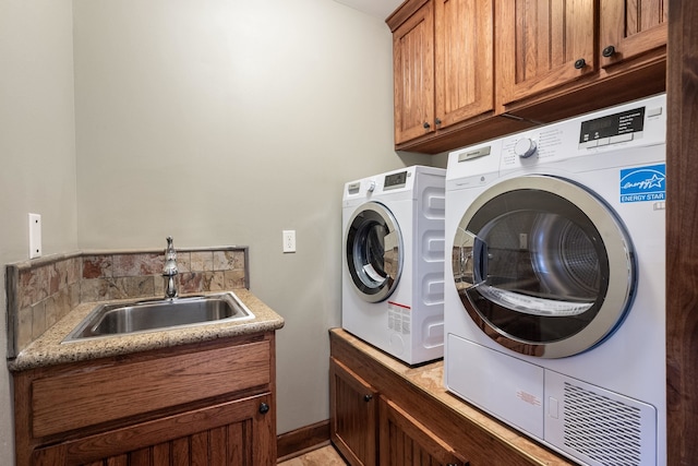 10204 N Wellen Ln, Spokane, WA 99218 - laundry area with cabinet space and washer and clothes dryer