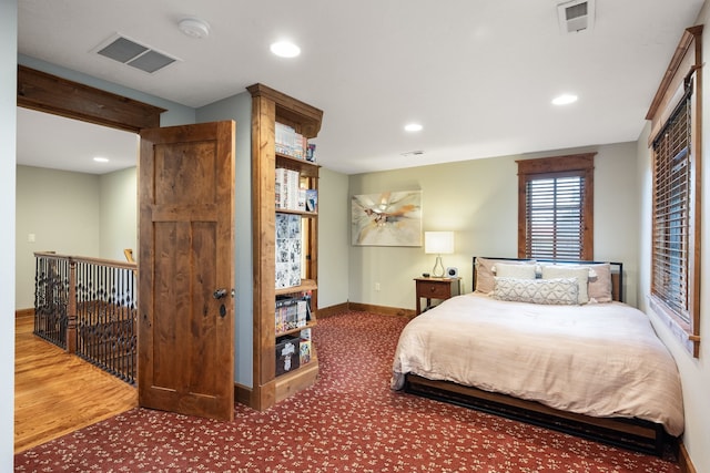 10204 N Wellen Ln, Spokane, WA 99218 - bedroom with recessed lighting, baseboards, carpet flooring, and wood finished floors