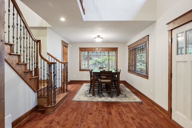 10204 N Wellen Ln, Spokane, WA 99218 - dining space with wood finished floors, stairs, baseboards, and recessed lighting