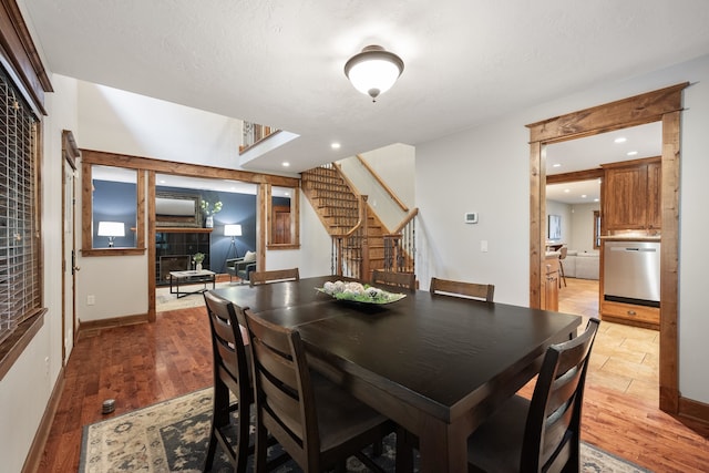 10204 N Wellen Ln, Spokane, WA 99218 - dining space with stairway, light wood-style flooring, recessed lighting, and baseboards