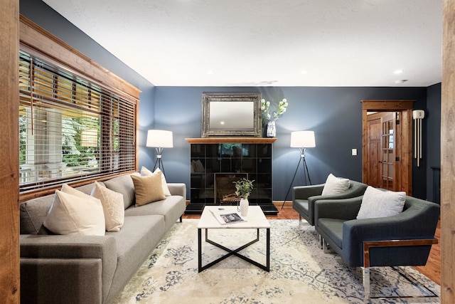 10204 N Wellen Ln, Spokane, WA 99218 - living area featuring wood finished floors and a tile fireplace
