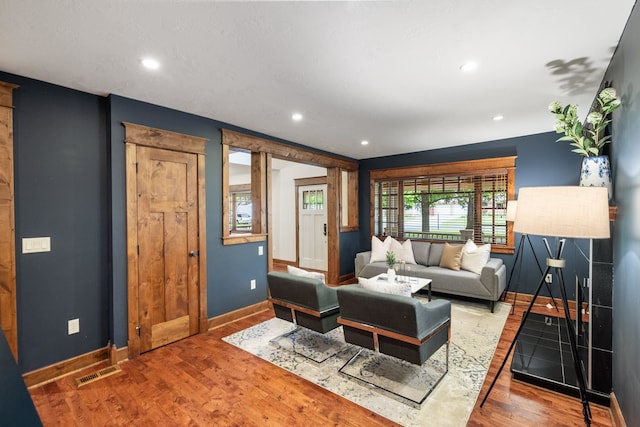 10204 N Wellen Ln, Spokane, WA 99218 - living room featuring baseboards, wood finished floors, and recessed lighting