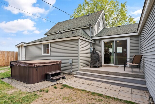 4521 E Fairview St, Spokane, WA 99217 - back of property featuring a hot tub and roof with shingles