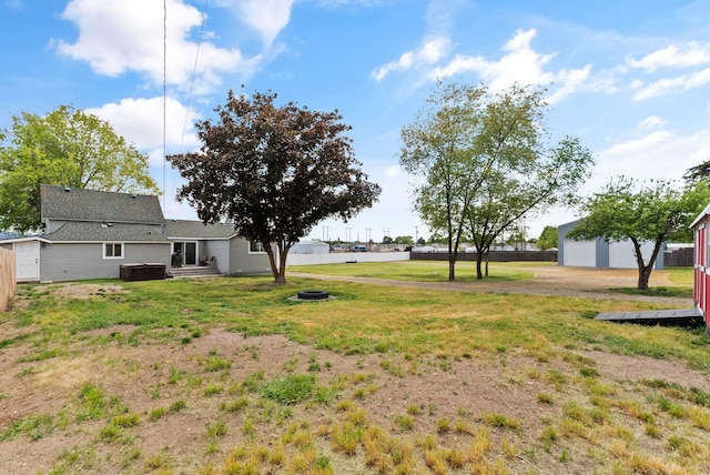 4521 E Fairview St, Spokane, WA 99217 - view of green lawn featuring an outbuilding and a detached garage