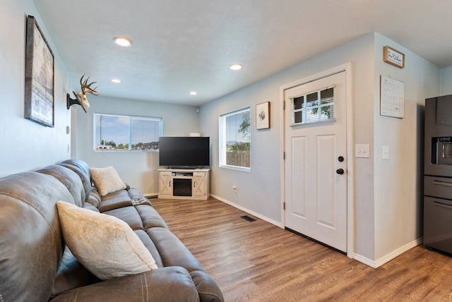 4521 E Fairview St, Spokane, WA 99217 - living room featuring wood finished floors, recessed lighting, and baseboards