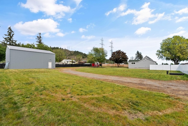 4521 E Fairview St, Spokane, WA 99217 - view of yard featuring an outbuilding and a pole building