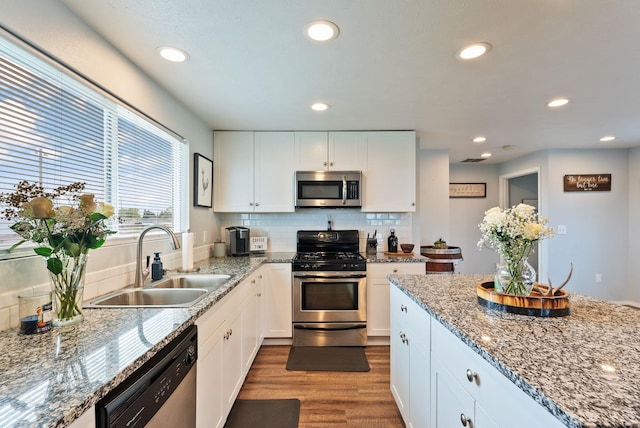 4521 E Fairview St, Spokane, WA 99217 - kitchen featuring stainless steel appliances, a sink, wood finished floors, white cabinetry, and recessed lighting