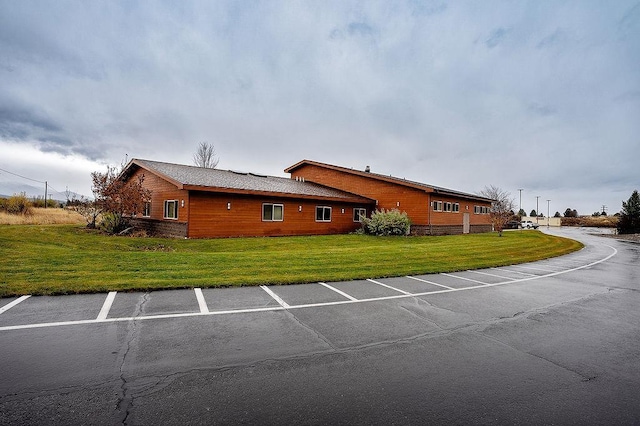 6701 N Idaho Rd, Newman Lake, WA 99025 - view of side of home with a lawn and uncovered parking