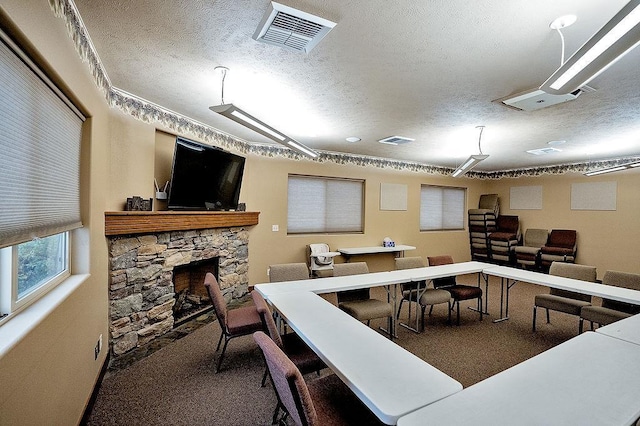 6701 N Idaho Rd, Newman Lake, WA 99025 - office area with a textured ceiling, carpet, and a fireplace