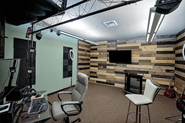 6701 N Idaho Rd, Newman Lake, WA 99025 - carpeted home office featuring wood walls and a garage