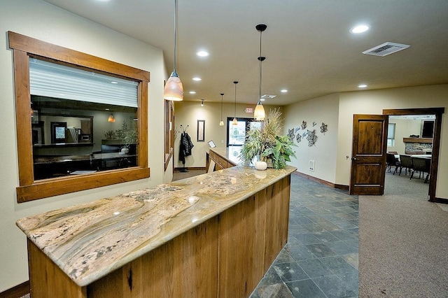 6701 N Idaho Rd, Newman Lake, WA 99025 - kitchen featuring recessed lighting, baseboards, light stone counters, and decorative light fixtures