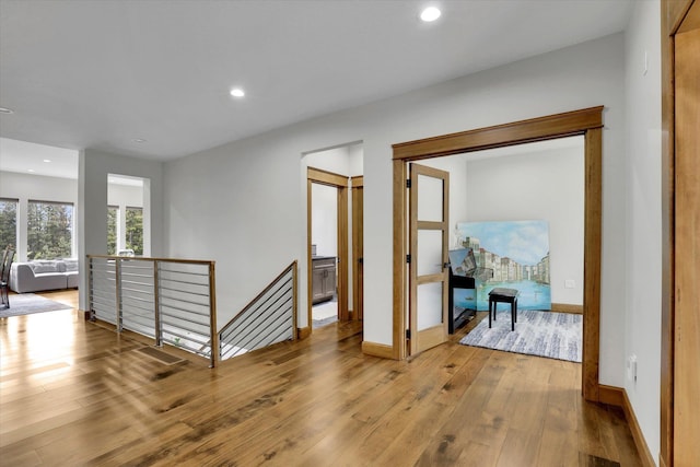 39980 Lake Summit Dr, Loon Lake, WA 99148 - hallway featuring an upstairs landing, hardwood / wood-style floors, recessed lighting, and baseboards