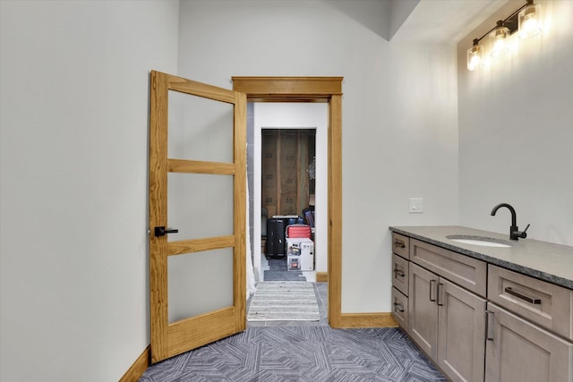 39980 Lake Summit Dr, Loon Lake, WA 99148 - bathroom with vanity, baseboards, and tile patterned floors