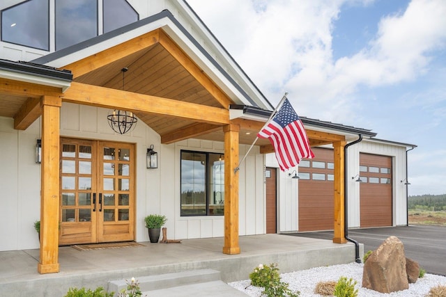 23114 W Mcfarlane Rd, Medical Lake, WA 99022 - property entrance with board and batten siding, covered porch, and french doors
