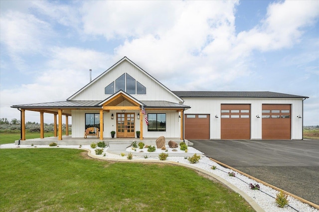 23114 W Mcfarlane Rd, Medical Lake, WA 99022 - modern farmhouse featuring french doors, a standing seam roof, a front yard, and driveway