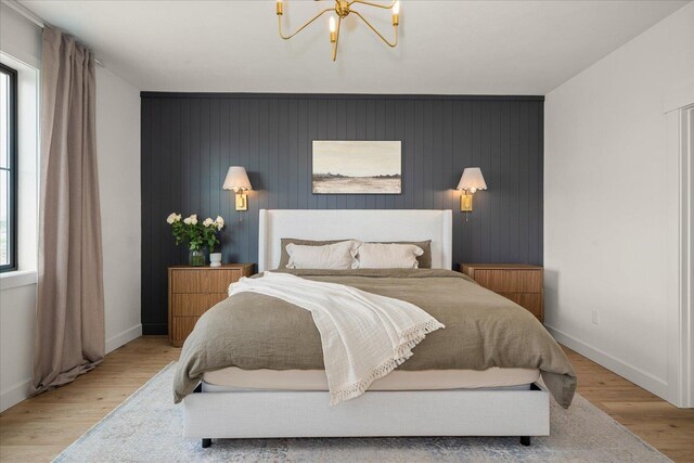 23114 W Mcfarlane Rd, Medical Lake, WA 99022 - bedroom featuring an accent wall, baseboards, and wood finished floors