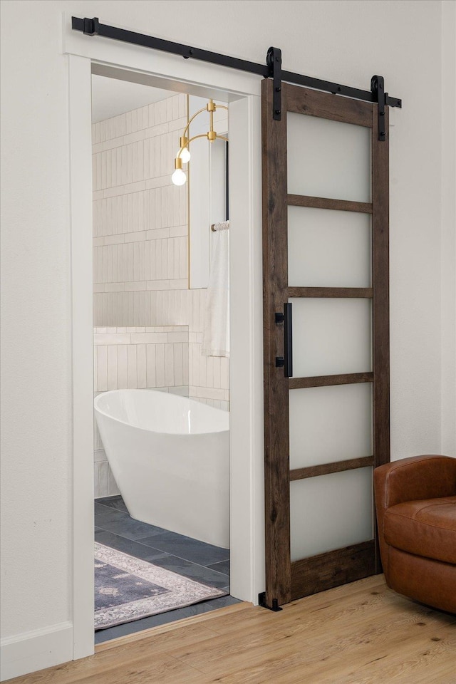 23114 W Mcfarlane Rd, Medical Lake, WA 99022 - bathroom with a soaking tub and wood finished floors
