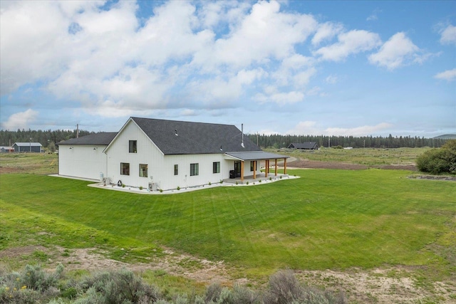 23114 W Mcfarlane Rd, Medical Lake, WA 99022 - back of property with a yard, a patio, and a shingled roof