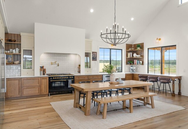 23114 W Mcfarlane Rd, Medical Lake, WA 99022 - dining room featuring high vaulted ceiling, a chandelier, light wood-style flooring, and recessed lighting