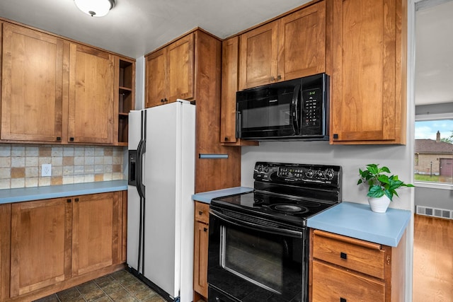 607 E Walton Ave, Spokane, WA 99207 - kitchen with black appliances, brown cabinets, open shelves, and backsplash
