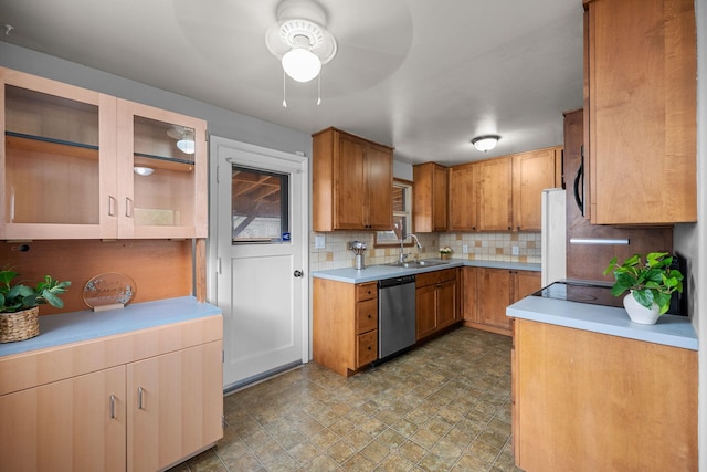 607 E Walton Ave, Spokane, WA 99207 - kitchen with stainless steel dishwasher, a sink, ceiling fan, decorative backsplash, and light countertops