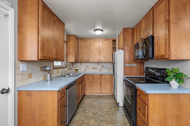607 E Walton Ave, Spokane, WA 99207 - kitchen featuring black appliances, a sink, backsplash, light countertops, and brown cabinetry