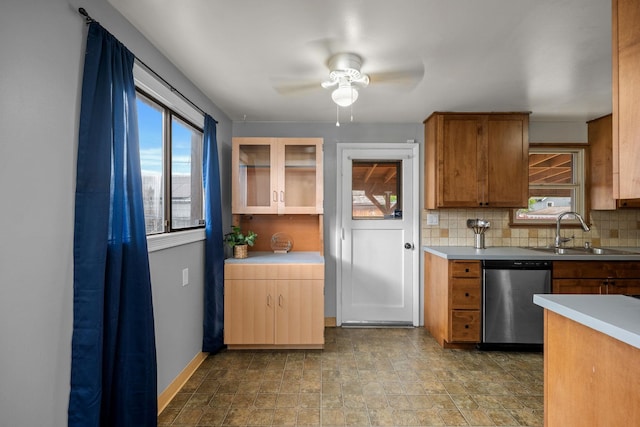 607 E Walton Ave, Spokane, WA 99207 - kitchen featuring dishwasher, a sink, decorative backsplash, and plenty of natural light