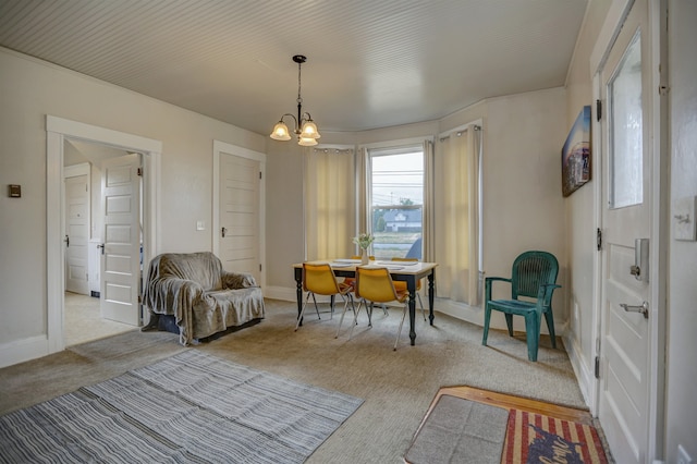 1608 E Pacific Ave, Spokane, WA 99202 - dining room with carpet floors, a chandelier, and baseboards