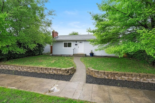 2417 E Nebraska Ave, Spokane, WA 99208 - view of front of home with a front yard and a chimney