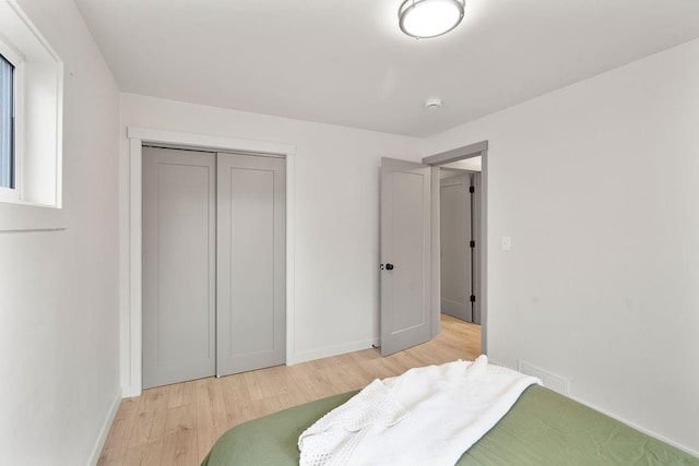 2417 E Nebraska Ave, Spokane, WA 99208 - bedroom with light wood-type flooring, baseboards, and a closet