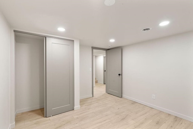 2417 E Nebraska Ave, Spokane, WA 99208 - unfurnished bedroom with light wood-style flooring, recessed lighting, baseboards, and a closet