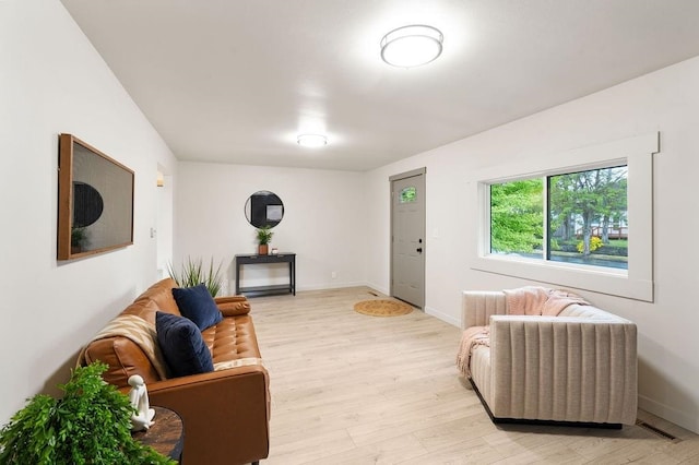 2417 E Nebraska Ave, Spokane, WA 99208 - living area featuring light wood-style flooring and baseboards