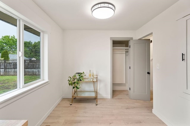2417 E Nebraska Ave, Spokane, WA 99208 - bedroom with multiple windows, light wood-style flooring, and baseboards