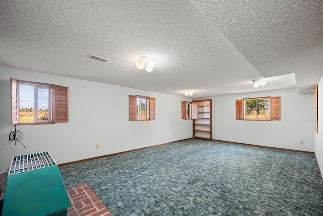 4796 W Gibson Dahl Rd, Clayton, WA 99110 - basement with carpet floors, a textured ceiling, and baseboards