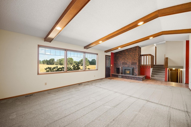 4796 W Gibson Dahl Rd, Clayton, WA 99110 - unfurnished living room featuring stairs, carpet floors, a brick fireplace, a textured ceiling, and baseboards