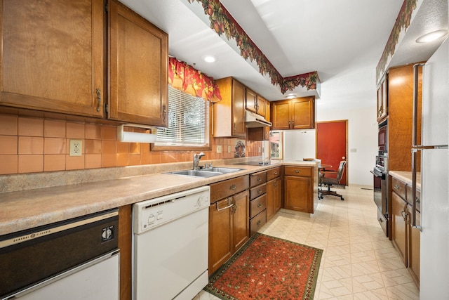 4796 W Gibson Dahl Rd, Clayton, WA 99110 - kitchen with white dishwasher, a sink, backsplash, black electric stovetop, and brown cabinets